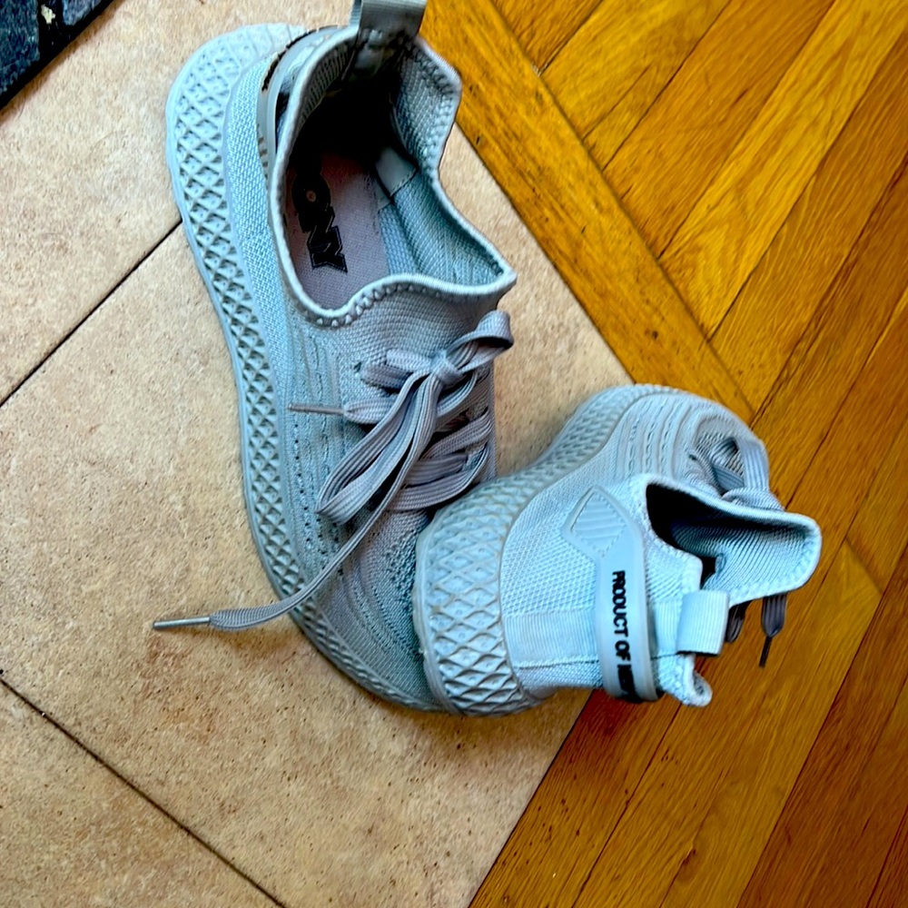 Pony , 8s size shoes and kinda white like an ace